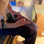 Hayley vet extern volunteer giving medicine to injured chameleon